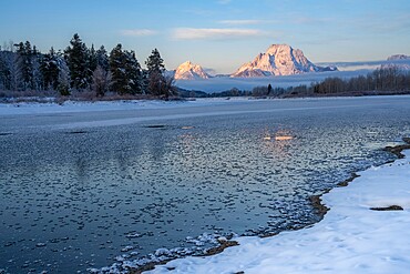 First light on Mount Moran at Oxbow Bend with reflection, Grand Teton National Park, Wyoming, United States of America, North America