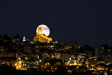 Moonrise of a full moon over Banyares Castle in Sierra Mariola, Alicante Province, Spain, Erope