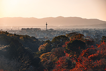 Kyoto Tower skyscraper at sunset seen from Kiyomizudera temple in autumn, Kyoto, Honshu, Japan, Asia