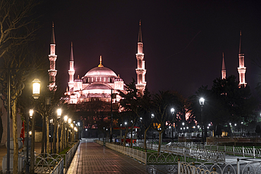 A night-time view of Blue Mosque (Sultanahmet Camii) brightly lit with numerous lights, creating a striking visual display against the dark sky,UNESCO World Heritage Site, Istanbul, Turkey, Europe