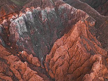 Kok-Moinok Canyon, a clay-sand structure formed on the slopes of arid mountains cut by water streams, Kyrgyzstan, Central Asia, Asia