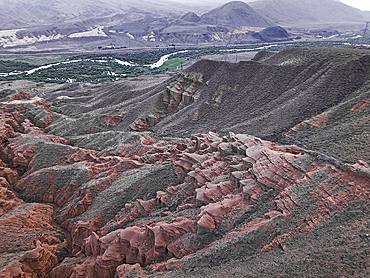 Kok-Moinok Canyon, a clay-sand structure formed on the slopes of arid mountains cut by water streams, Kyrgyzstan, Central Asia, Asia