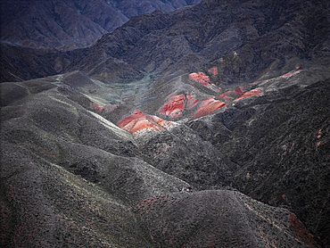 Aerial view of Kok-Moinok Canyon, a clay-sand structure formed on the slopes of arid mountains cut by water streams, Kyrgyzstan, Central Asia, Asia