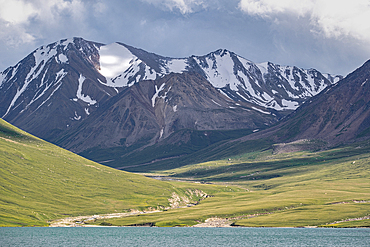 Scenic mountain landscape with lush greenery and snow-capped peaks above Kol Ukok Lake, Kyrgyzstan, Central Asia, Asia