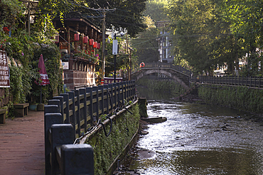 A glimpse of the river and the ancient city of Shangli with its wooden houses
