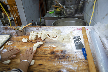 handmade noodles on a wooden cutting board