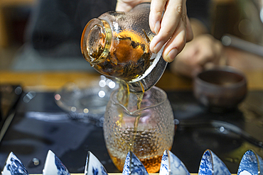 Tea ceremony - tea poured in a glass