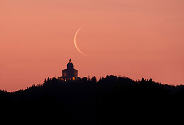 Waning crescent moon at sunrise above San Luca Sanctuary, Bologna, Emilia Romagna, Italy, Europe