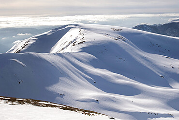 Gentle mountains fully covered by snow in the Corno alle Scale regional park, Emilia Romagna, Italy, Europe