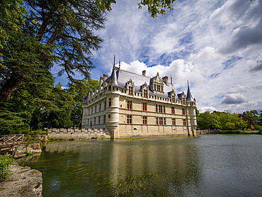 Castle of Azay-le-Rideau reflected in lake in a sunny day with clouds, UNESCO World Heritage Site, Azay-le-Rideau, Indre et Loire, Centre-Val de Loire, France, Europe