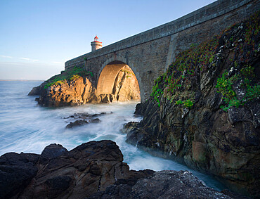 Cliffs and the bridge that lead to the Petit Minou lighthouse with side light at sunset, Finistere, Brittany, France, Europe