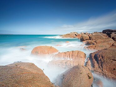 Long esposure of water and cliffs in the cote de granite rose in Brittany, France