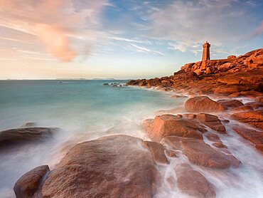 Sunset long exposure at Ploumanac???h lighthouse with the pink granite coast in Brittany. France