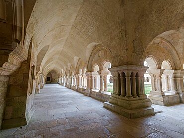 Long corridor of the cloister of Unesco world heritage site of Abbey of Fontenay, France