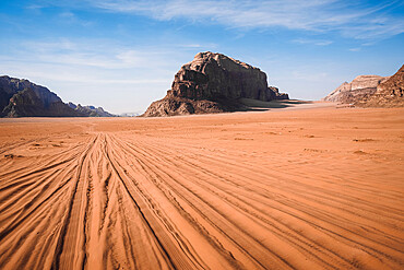 Tire tracks in the sand in the Wadi Rum desert