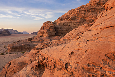 Red rocks and mountains at sunset in the Wadi Rum desert in Jordan