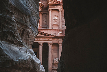 Petra Treasury (El Khazneh) partially hidden, reveals itself at the end of the Siq canyon, Petra, UNESCO World Heritage Site, Jordan, Middle East