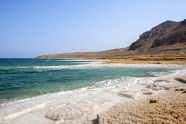 Beach with salt crystalized formation and turquoise water, The Dead Sea, Jordan, Middle East