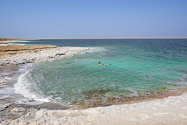 Shore with salt crystalized formation and turquoise water, The Dead Sea, Jordan, Middle East