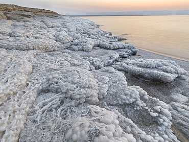 Shore with salt crystalized formation at dusk, The Dead Sea, Jordan, Middle East