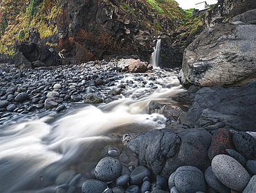 Long exposure of a waterfall falling into the ocean in Porto de Pescas da Achada on Sao Miguel island, Azores Islands, Portugal, Atlantic, Europe