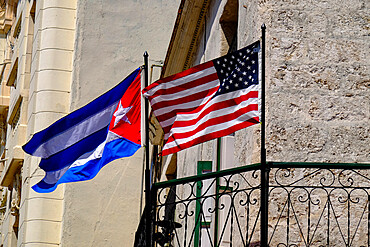 Cuban and American flags waving side by side, Old Havana, Cuba, West Indies, Central America