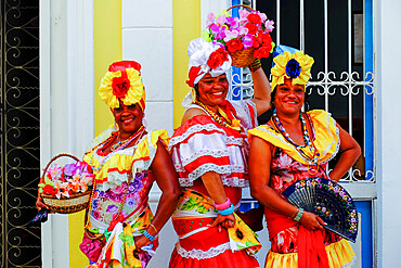 Three colorful ladies in traditional dress, Old Havana, Cuba, West Indies, Central America