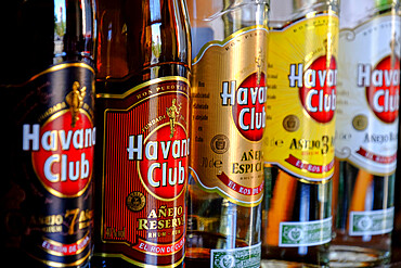 Havana Club bottles lined up at a bar, Cienfuegos, Cuba, West Indies, Central America