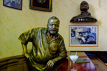 Life-size sculpture of Ernest Hemingway sitting at the bar of the Floridita, Havana, Cuba, West Indies, Central America