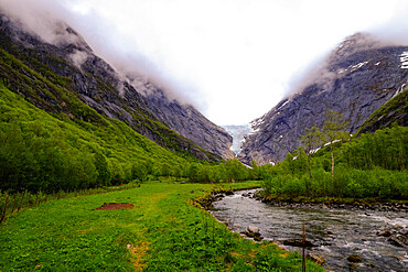 A glacial stream flows from the Briksdal glacier, Stryn, Vestland, Norway, Scandinavia, Europe