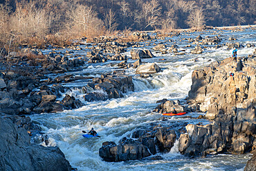 Kayakers thread their way down a series of challenging drops that make up Great Falls of the Potomac River, Virginia, United States of America, North America