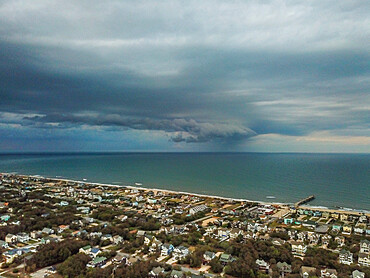 Rain squall moves across the Atlantic Ocean offshore of Nags Head, North Carolina, United States of America, North America