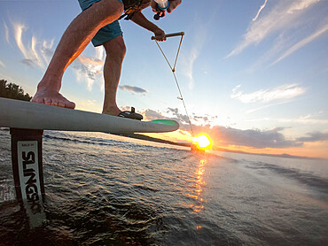 Photographer Skip Brown foils behind a small boat on Sebago Lake, Maine, United States of America, North America