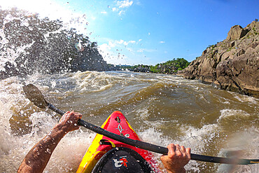 Photographer Skip Brown surfs his kayak on a whitewater wave on the Potomac River, border of Virginia and Maryland, United States of America, North America