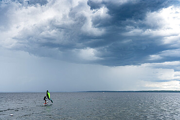 Skip Brown wind surfing into some weather on Sebago Lake, Maine, United States of America, North America