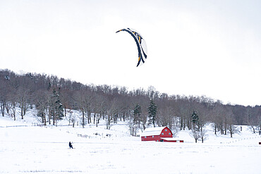 Snow kiting a snow covered farm field in Canaan Valley, West Virginia, United States of America, North America