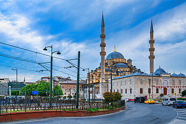 Yeni mosque illuminated at sunset in Istanbul, Turkey