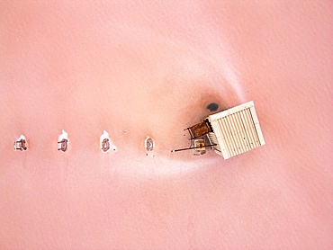 Tuz salt lake drone aerial view of house in the lake with pink salt around, in Turkey