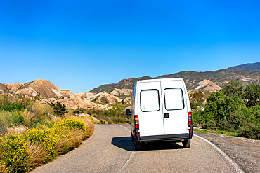 Camper van on Tabernas desert on a sunny day, Almeria, Andalusia, Spain, Europe