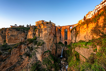 View with beautiful bridge and waterfall and traditional white village, Ronda, Pueblos Blancos, Andalusia, Spain, Europe