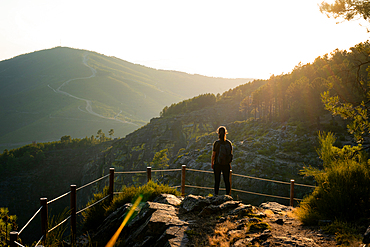 Woman looking at nature and mountain landscape from a viewpoint in Mondim de Basto, Norte, Portugal, Europe