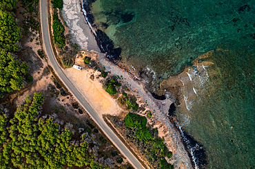 Aerial drone view above view of camper van with solar panels on Sardinia coast, Sardinia, Italy, Mediterranean, Europe