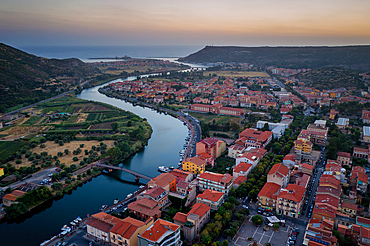 Bosa colorful city buildings, aerial drone view with Temo river and Mediterranean Sea at sunset, Bosa, Sardinia, Italy, Mediterranean, Europe