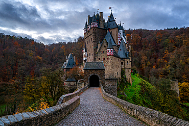 Eltz medieval historic castle in an autumn landscape with trees at sunrise, Wierschem, Rhineland-Palatinate, Germany, Europe