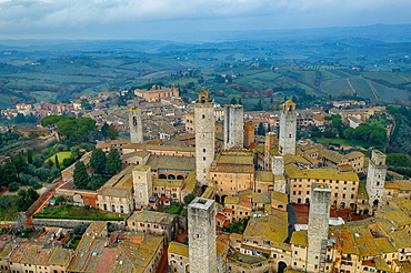 San Gimignano historic medieval village with iconic towers drone aerial view in Tuscany, Italy