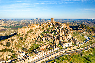 Craco ghost town abandoned by the population in the south of Italy, drone aerial view at sunset, Basilicata, Italy, Europe