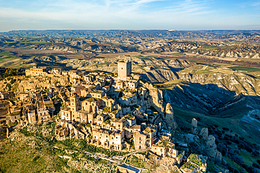 Crato ghost town abandoned by the population in the south of Italy drone aerial view at sunset