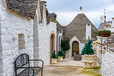 Alberobello iconic old Trullo and Trulli white houses with stone ceilings in conical shape, UNESCO World Heritage Site, Alberobello, Apulia, Italy, Europe