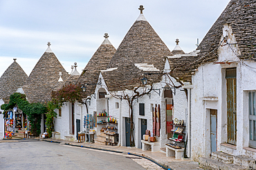 Alberobello iconic old Trullo and Trulli white houses with stone ceilings in conic shape, in Italy