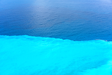 Sea division between turquoise water and deep blue, in Greece